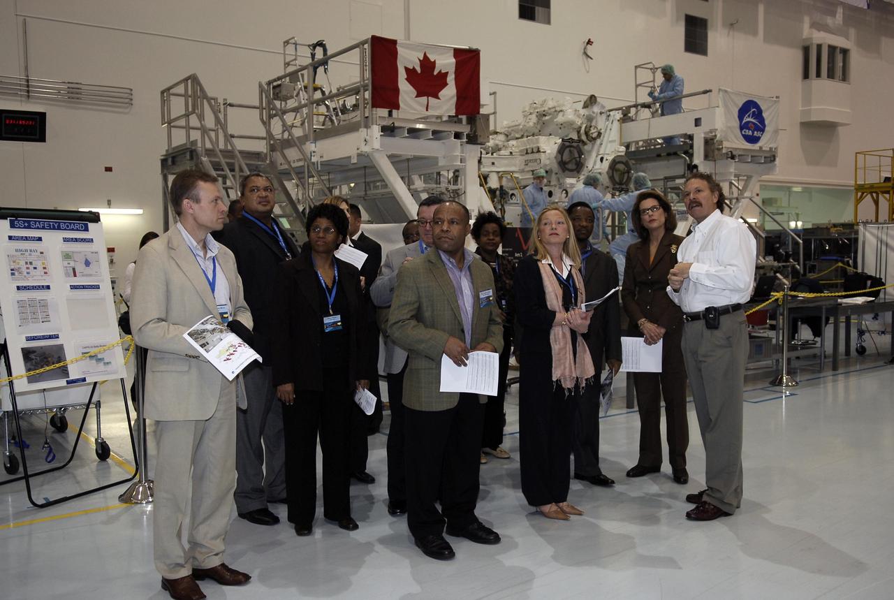 KENNEDY SPACE CENTER, FLA. -- A group of The Chiefs of Diplomatic Missions from more than 45 countries tour the Space Station Processing Facility.  At right, Russell Romanella, director of the International Space Station and Payload Processing Directorate, talks about the space station program. The visit, one of the largest tours undertaken by the diplomatic corps, is part of the State Department's new Experience America program. The international dignitaries were provided an overview of the United States' space exploration programs and NASA's international cooperation in pursuit of exploration and scientific discovery. They visited various locations at Kennedy, including the Space Station Processing Facility and Launch Pad 39A where space shuttle Atlantis is being prepared for its upcoming mission to the International Space Station.   Photo credit: NASA/Kim Shiflett