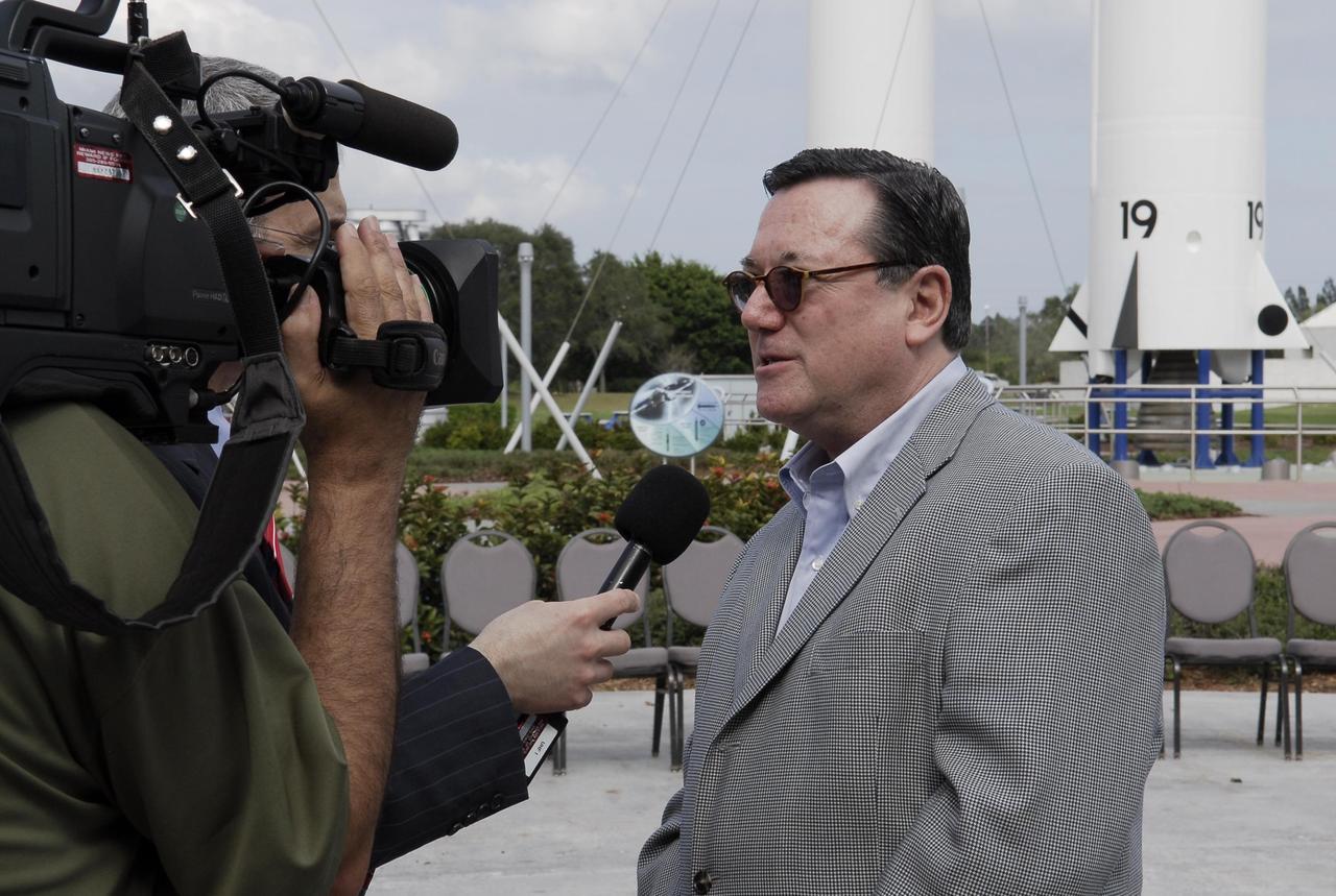 KENNEDY SPACE CENTER, FLA. -- In the rocket garden at NASA's Kennedy Space Center Visitor Complex, Gilles Noghes, ambassador of Monaco, is interviewed.  Noghes is one of The Chiefs of Diplomatic Missions from more than 45 countries who toured various facilities around Kennedy. The visit, one of the largest tours undertaken by the diplomatic corps, is part of the State Department's new Experience America program. The international dignitaries were provided an overview of the United States' space exploration programs and NASA's international cooperation in pursuit of exploration and scientific discovery. They visited various locations at Kennedy, including the Space Station Processing Facility and Launch Pad 39A where space shuttle Atlantis is being prepared for its upcoming mission to the International Space Station.   Photo credit: NASA/Kim Shiflett