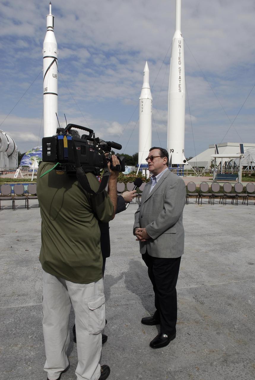 KENNEDY SPACE CENTER, FLA. -- In the rocket garden at NASA's Kennedy Space Center Visitor Complex, Gilles Noghes, ambassador of Monaco, is interviewed.  Noghes is one of The Chiefs of Diplomatic Missions from more than 45 countries who toured various facilities around Kennedy. The visit, one of the largest tours undertaken by the diplomatic corps, is part of the State Department's new Experience America program. The international dignitaries were provided an overview of the United States' space exploration programs and NASA's international cooperation in pursuit of exploration and scientific discovery. They visited various locations at Kennedy, including the Space Station Processing Facility and Launch Pad 39A where space shuttle Atlantis is being prepared for its upcoming mission to the International Space Station.   Photo credit: NASA/Kim Shiflett
