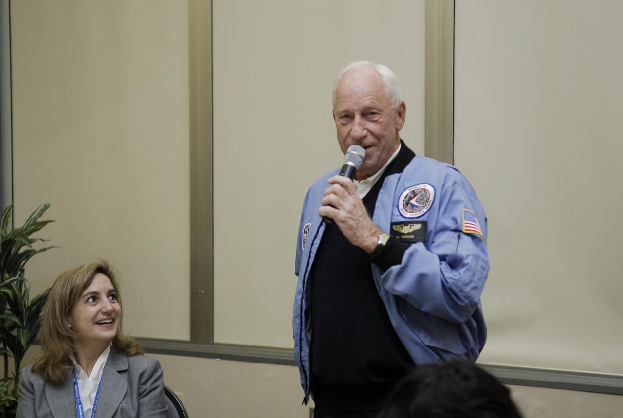 KENNEDY SPACE CENTER, FLA. -- Former astronaut Al Worden talks to members of the diplomatic corps, who toured various facilities around Kennedy. The visit, one of the largest tours undertaken by the diplomatic corps, is part of the State Department's new Experience America program. The international dignitaries were provided an overview of the United States' space exploration programs and NASA's international cooperation in pursuit of exploration and scientific discovery. They visited various locations at Kennedy, including the Space Station Processing Facility and Launch Pad 39A where space shuttle Atlantis is being prepared for its upcoming mission to the International Space Station.   Photo credit: NASA/Kim Shiflett