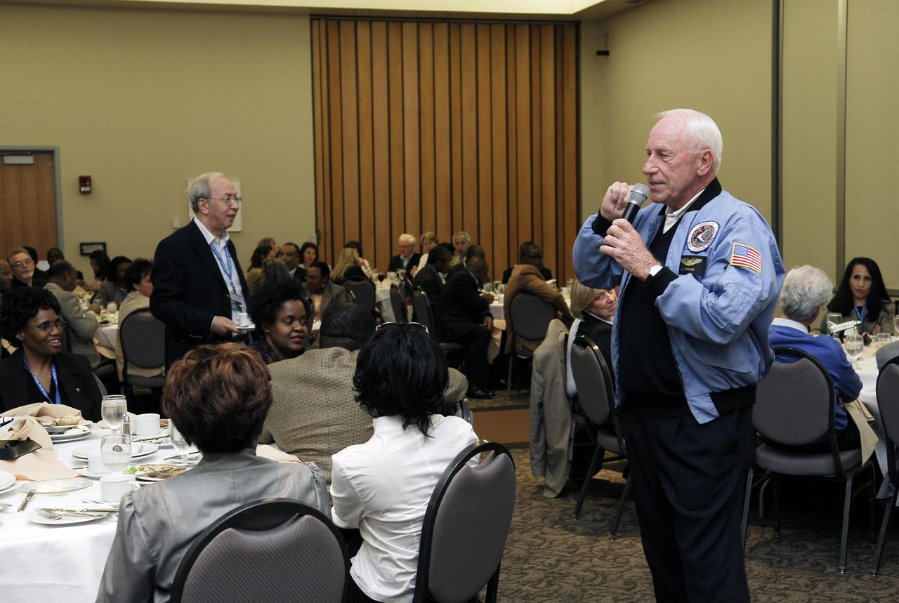 KENNEDY SPACE CENTER, FLA. -- Former astronaut Al Worden talks to members of the diplomatic corps, who toured various facilities around Kennedy. The visit, one of the largest tours undertaken by the diplomatic corps, is part of the State Department's new Experience America program. The international dignitaries were provided an overview of the United States' space exploration programs and NASA's international cooperation in pursuit of exploration and scientific discovery. They visited various locations at Kennedy, including the Space Station Processing Facility and Launch Pad 39A where space shuttle Atlantis is being prepared for its upcoming mission to the International Space Station.   Photo credit: NASA/Kim Shiflett