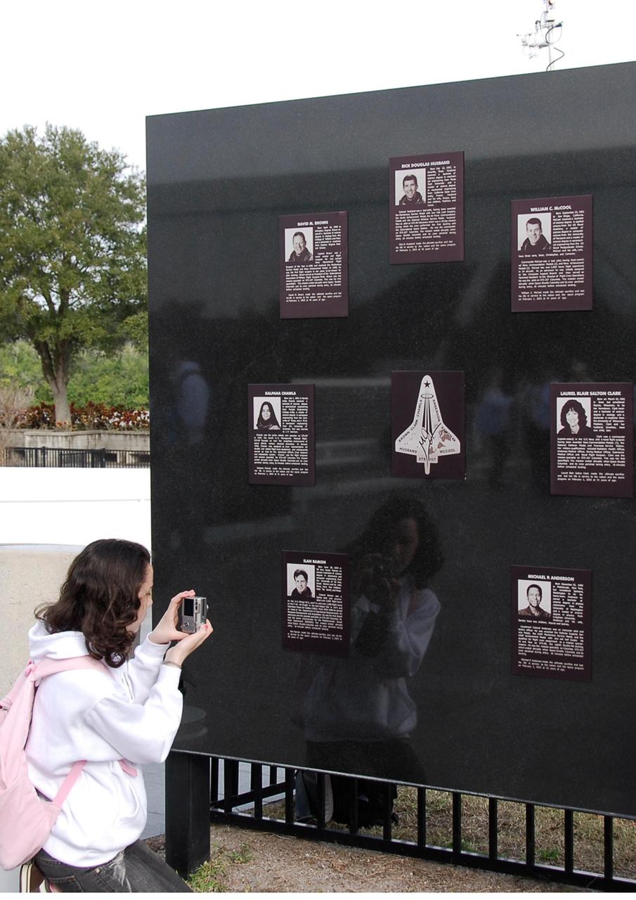 KENNEDY SPACE CENTER, FLA. -- A visitor at NASA's Kennedy Space Center Visitor Complex photographs the special memorial for the seven crew members of Columbia who were lost as they returned from mission STS-107 in 2003.  Kennedy marked the NASA Day of Remembrance with special ceremonies.  This year the crew of Columbia was remembered in a special way on the day that marked the fifth anniversary of the Columbia accident.   Photo credit: NASA/Kim Shiflett