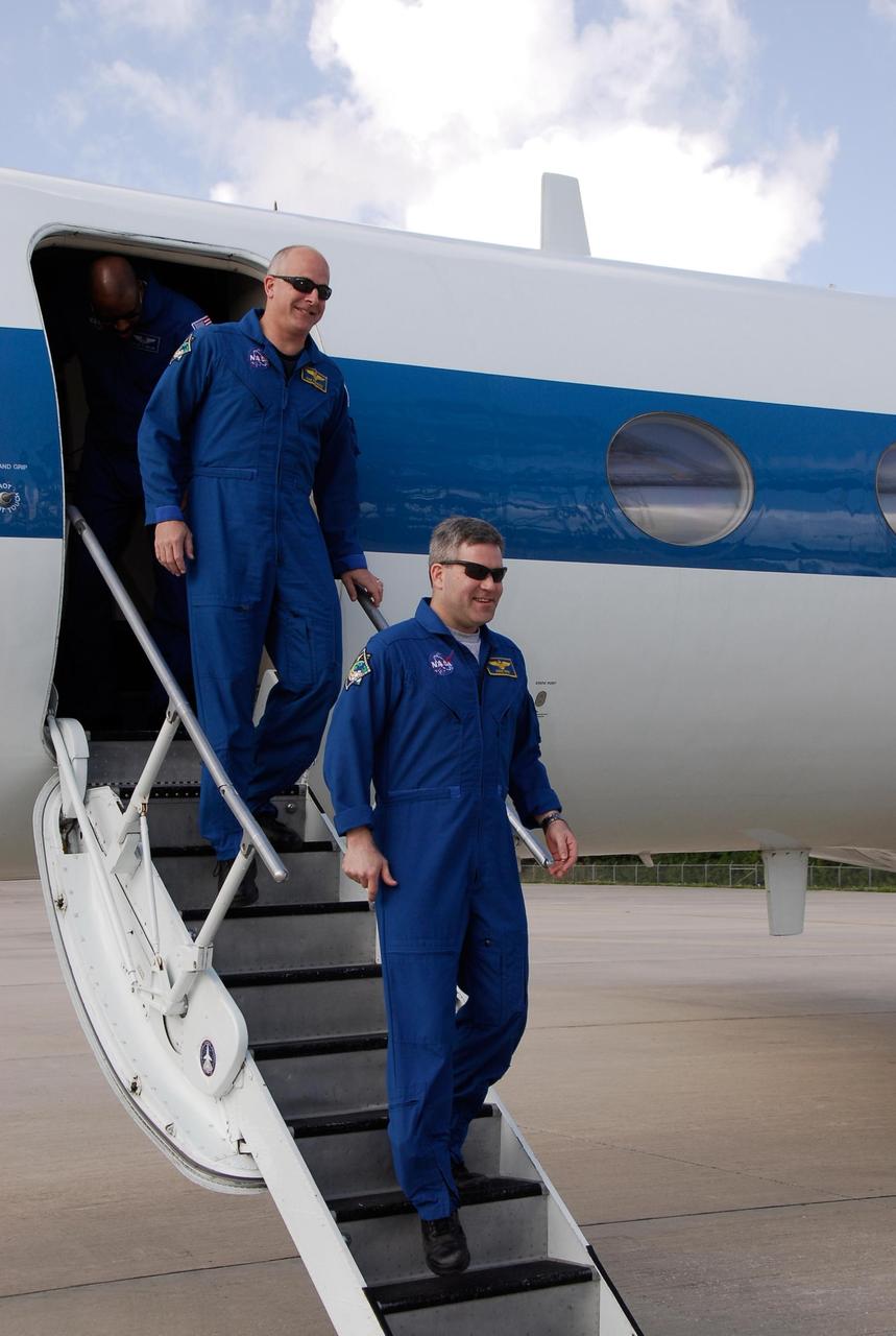 KENNEDY SPACE CENTER, FLA. -- STS-122 Commander Steve Frick (right) and Pilot Alan Poindexter arrive at NASA's Kennedy Space Center in a shuttle training aircraft jet for launch aboard space shuttle Atlantis on Feb. 7. The crew's arrival signals the imminent launch of space shuttle Atlantis' STS-122 mission, at 2:45 p.m. Feb. 7. This will be the third launch attempt for the mission. Some of the tank's ECO sensors gave failed readings during propellant tanking for launch attempts on Dec. 6 and Dec. 9, subsequently scrubbing further attempts until the cause could be found and repairs made. Atlantis will carry the Columbus module, Europe's largest contribution to the construction of the International Space Station. It will support scientific and technological research in a microgravity environment. Columbus is a multifunctional, pressurized laboratory that will be permanently attached to the Harmony module of the space station to carry out experiments in materials science, fluid physics and biosciences, as well as to perform a number of technological applications. Photo credit: NASA/Kim Shiflett