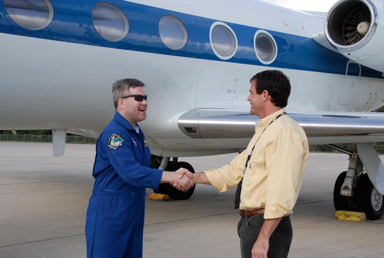 KENNEDY SPACE CENTER, FLA. -- After arriving at NASA's Kennedy Space Center, STS-122 Commander Steve Frick is greeted by Doug Lyons, launch director for STS-122 mission. The crew's arrival signals the imminent launch of space shuttle Atlantis' STS-122 mission, at 2:45 p.m. Feb. 7. This will be the third launch attempt for the mission. Some of the tank's ECO sensors gave failed readings during propellant tanking for launch attempts on Dec. 6 and Dec. 9, subsequently scrubbing further attempts until the cause could be found and repairs made. Atlantis will carry the Columbus module, Europe's largest contribution to the construction of the International Space Station. It will support scientific and technological research in a microgravity environment. Columbus is a multifunctional, pressurized laboratory that will be permanently attached to the Harmony module of the space station to carry out experiments in materials science, fluid physics and biosciences, as well as to perform a number of technological applications. Photo credit: NASA/Kim Shiflett