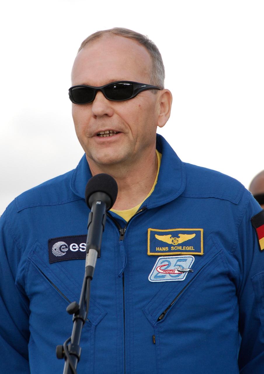 KENNEDY SPACE CENTER, FLA. -- After his arrival at NASA's Kennedy Space Center, STS-122 Mission Specialist Hans Schlegel tells the media he is grateful for the hard work and dedication of workers in getting Atlantis and Columbus ready for flight. Schlegel represents the European Space Agency. The crew's arrival signals the imminent launch of space shuttle Atlantis' STS-122 mission, at 2:45 p.m. Feb. 7. This will be the third launch attempt for the mission. Some of the tank's ECO sensors gave failed readings during propellant tanking for launch attempts on Dec. 6 and Dec. 9, subsequently scrubbing further attempts until the cause could be found and repairs made. Atlantis will carry the Columbus module, Europe's largest contribution to the construction of the International Space Station. It will support scientific and technological research in a microgravity environment. Columbus is a multifunctional, pressurized laboratory that will be permanently attached to the Harmony module of the space station to carry out experiments in materials science, fluid physics and biosciences, as well as to perform a number of technological applications. Photo credit: NASA/Kim Shiflett