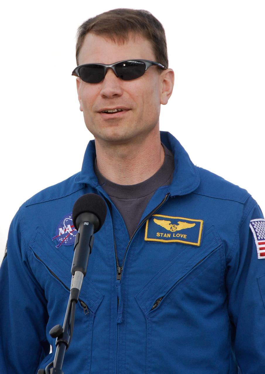 KENNEDY SPACE CENTER, FLA. -- After his arrival at NASA's Kennedy Space Center, STS-122 Mission Specialist Stanley Love tells the media he is grateful to the shuttle workers for their efforts in getting Atlantis ready for flight. The crew's arrival signals the imminent launch of space shuttle Atlantis' STS-122 mission, at 2:45 p.m. Feb. 7. This will be the third launch attempt for the mission. Some of the tank's ECO sensors gave failed readings during propellant tanking for launch attempts on Dec. 6 and Dec. 9, subsequently scrubbing further attempts until the cause could be found and repairs made. Atlantis will carry the Columbus module, Europe's largest contribution to the construction of the International Space Station. It will support scientific and technological research in a microgravity environment. Columbus is a multifunctional, pressurized laboratory that will be permanently attached to the Harmony module of the space station to carry out experiments in materials science, fluid physics and biosciences, as well as to perform a number of technological applications. Photo credit: NASA/Kim Shiflett