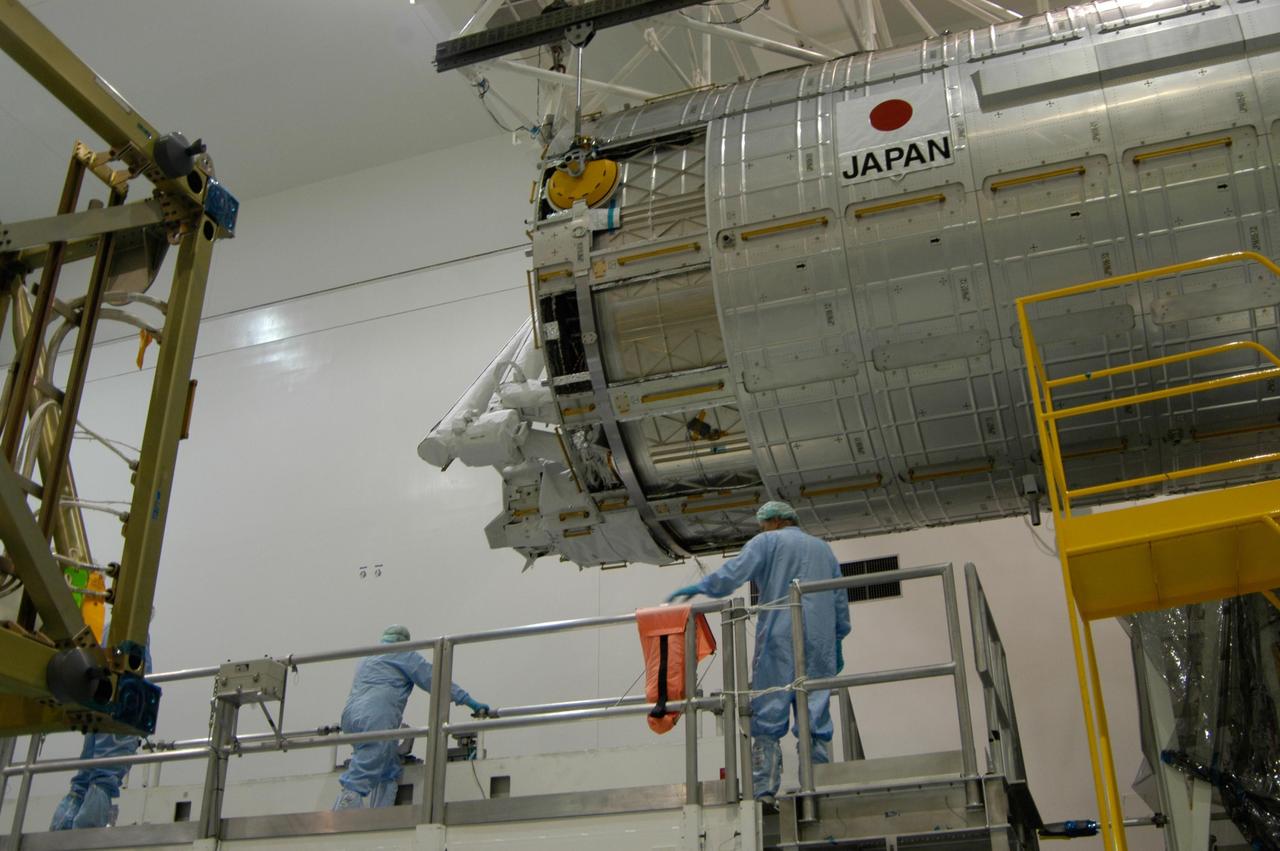 KENNEDY SPACE CENTER, FLA. -- In the Space Station Processing Facility at NASA's Kennedy Space Center, workers stand by as an overhead crane moves the Japanese Experiment Module, called Kibo, onto the scale for weighing. Also known as the JEM-PM, the module is the primary payload for space shuttle Discovery's STS-124 mission, which is targeted for launch to the International Space Station on April 24. Photo credit: NASA/Jim Cain