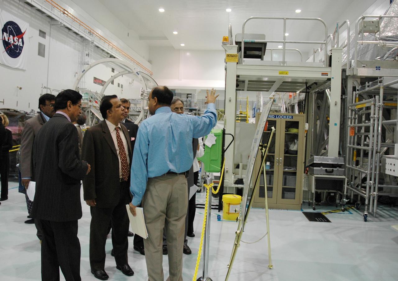 KENNEDY SPACE CENTER, FLA. -- After signing a framework agreement establishing the terms for future cooperation between NASA and the Indian Space Research Organization, Chairman G. Madhavan Nair (center) and other members are given a tour of the Space Station Processing Facility at NASA's Kennedy Space Center. The agreement establishes the terms for future cooperation between the two agencies in the exploration and use of outer space for peaceful purposes. According to the framework agreement, the two agencies will identify areas of mutual interest and seek to develop cooperative programs or projects in Earth and space science, exploration, human space flight and other activities. In addition to a long history of cooperation in Earth science, NASA and the Indian Space Research Organization also are cooperating on India's first, mission to the moon, Chandrayaan-1, which will be launched later this year. NASA is providing two of the 11 instruments on the spacecraft: the moon mineralogy mapper instrument and the miniature synthetic aperture radar instrument. Photo credit: NASA/Kim Shiflett