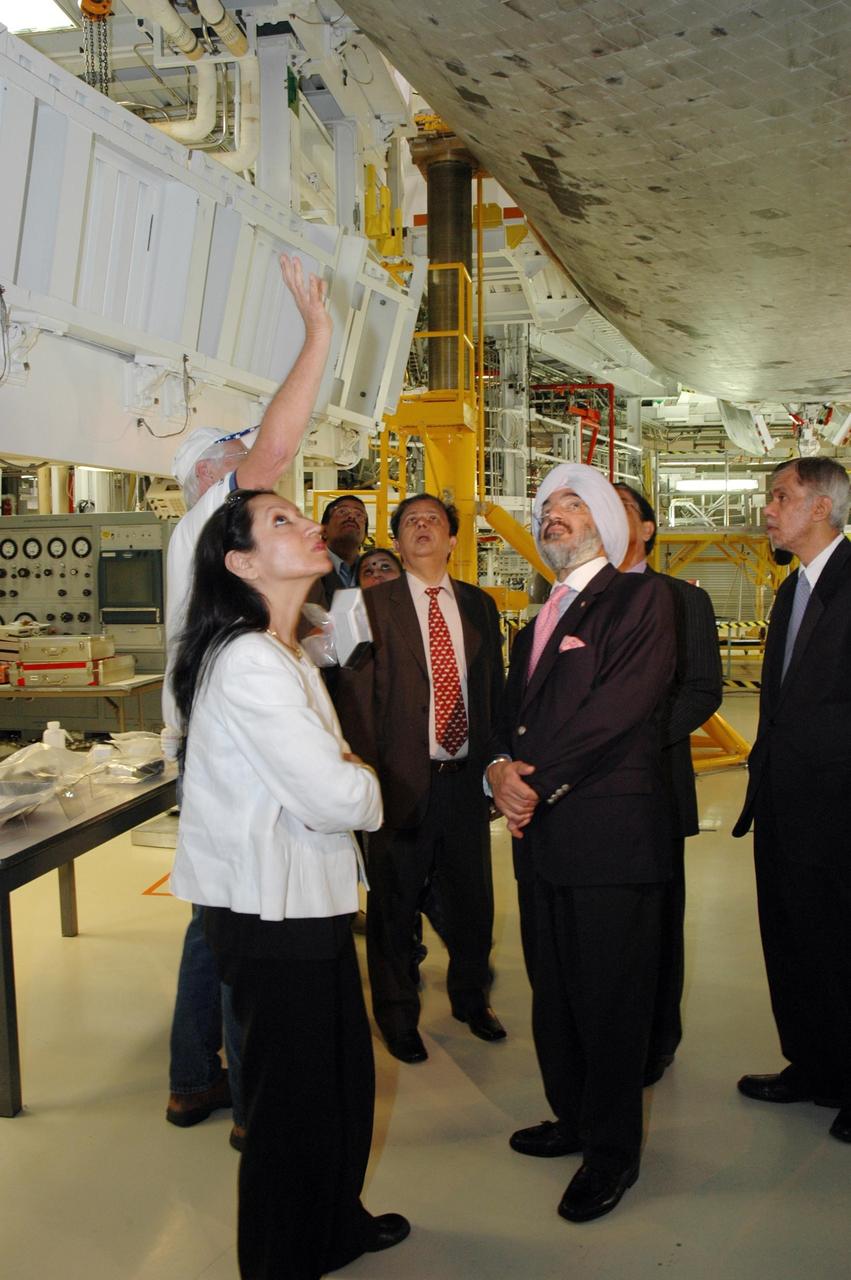 KENNEDY SPACE CENTER, FLA. -- After signing a framework agreement establishing the terms for future cooperation between NASA and the Indian Space Research Organization, Chairman G. Madhavan Nair (center) and other members are given a tour of the Space Station Processing Facility at NASA's Kennedy Space Center. The agreement establishes the terms for future cooperation between the two agencies in the exploration and use of outer space for peaceful purposes. According to the framework agreement, the two agencies will identify areas of mutual interest and seek to develop cooperative programs or projects in Earth and space science, exploration, human space flight and other activities. In addition to a long history of cooperation in Earth science, NASA and the Indian Space Research Organization also are cooperating on India's first, mission to the moon, Chandrayaan-1, which will be launched later this year. NASA is providing two of the 11 instruments on the spacecraft: the moon mineralogy mapper instrument and the miniature synthetic aperture radar instrument. Photo credit: NASA/Kim Shiflett
