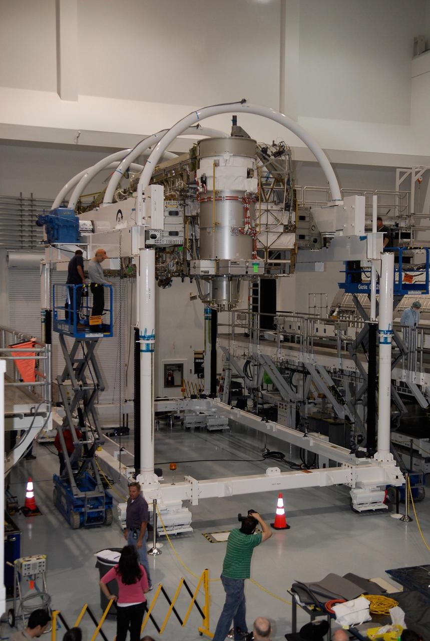 KENNEDY SPACE CENTER, FLA. -- In the Space Station Processing Facility at NASA's Kennedy Space Center, workers check the starboard integrated truss, known as S6, after its full rotation. The truss was rotated in order to remove and replace lower deck batteries. The final starboard truss in the assembly of the International Space Station, the S6 is scheduled to fly on the STS-119 space shuttle mission, whose launch date is not yet determined. Photo credit: NASA/Kim Shiflett