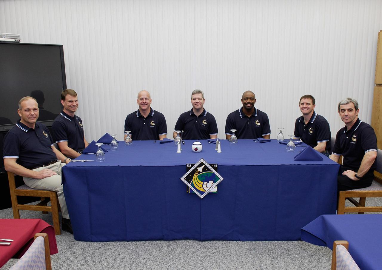 KENNEDY SPACE CENTER, FLA. -- At NASA's Kennedy Space Center, the STS-122 mission crew members have gathered for the traditional breakfast before they launch today on space shuttle Atlantis to the International Space Station. Around the table, from left, are Mission Specialists Hans Schlegel and Stanley Love, Pilot Alan Poindexter, Commander Steve Frick, and Mission Specialists Leland Melvin, Rex Walheim and Leopold Eyharts. Schlegel and Eyharts represent the European Space Agency. The launch is scheduled for 2:45 p.m. EST. It will be the third launch attempt for Atlantis since December 2007 to carry the European Space Agency's Columbus laboratory to the International Space Station. During the 11-day mission, the crew's prime objective is to attach the laboratory to the Harmony module, adding to the station's size and capabilities. Photo credit: NASA/Kim Shiflett