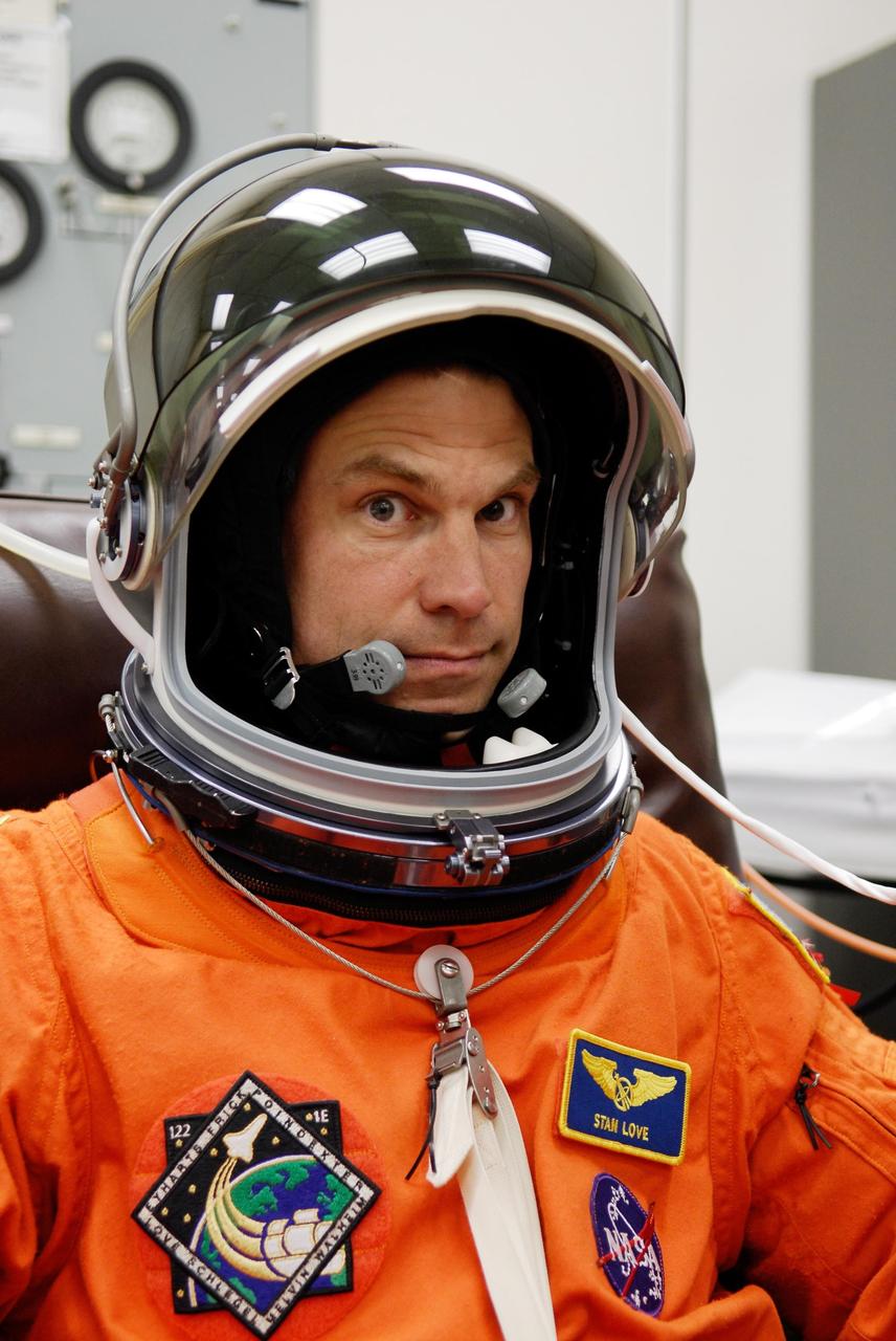 KENNEDY SPACE CENTER, FLA. --Mission Specialist Stanley Love tests the communication in his helmet as he completes suitup for launch of space shuttle Atlantis on the STS-122 mission. The launch, scheduled for 2:45 p.m. EST, will be the third attempt for Atlantis since December 2007 to carry the European Space Agency's Columbus laboratory to the International Space Station. During the 11-day mission, the crew's prime objective is to attach the laboratory to the Harmony module, adding to the station's size and capabilities. Photo credit: NASA/Kim Shiflett