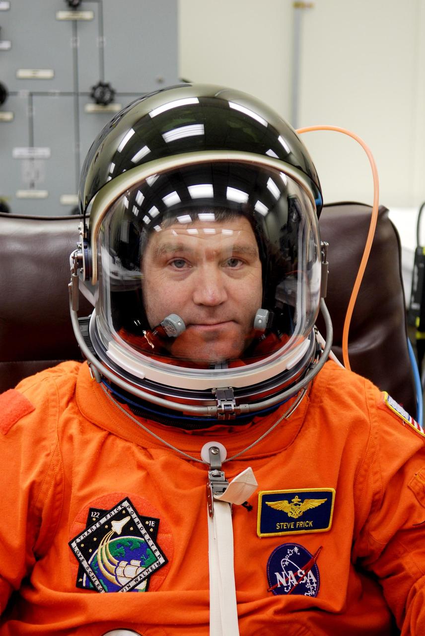 KENNEDY SPACE CENTER, FLA. -- Commander Steve Frick completes suiting up for the launch of space shuttle Atlantis on the STS-122 mission. The launch, scheduled for 2:45 p.m. EST, will be the third attempt for Atlantis since December 2007 to carry the European Space Agency's Columbus laboratory to the International Space Station. During the 11-day mission, the crew's prime objective is to attach the laboratory to the Harmony module, adding to the station's size and capabilities. Photo credit: NASA/Kim Shiflett