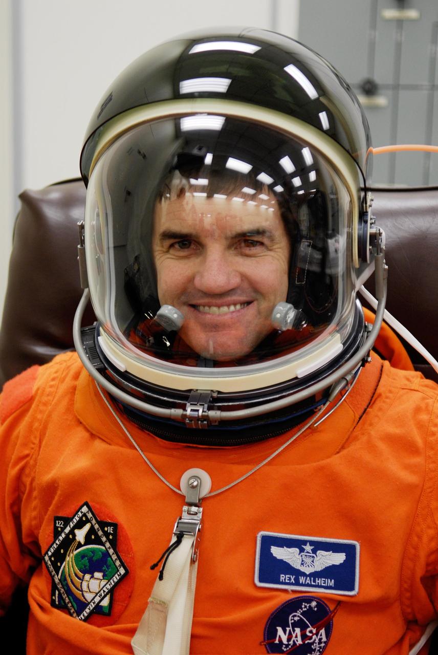 KENNEDY SPACE CENTER, FLA. -- Mission Specialist Rex Walheim completes suiting up for the launch of space shuttle Atlantis on the STS-122 mission. The launch, scheduled for 2:45 p.m. EST, will be the third attempt for Atlantis since December 2007 to carry the European Space Agency's Columbus laboratory to the International Space Station. During the 11-day mission, the crew's prime objective is to attach the laboratory to the Harmony module, adding to the station's size and capabilities. Photo credit: NASA/Kim Shiflett