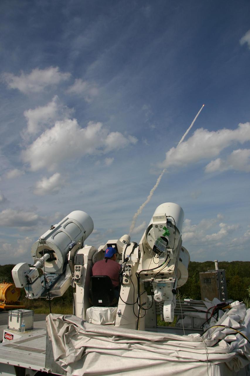 KENNEDY SPACE CENTER, FLA. --  A long-range tracking camera captures images of space shuttle Atlantis as it launches on mission STS-122 from Launch Pad 39A at NASA's Kennedy Space Center.  Liftoff was on time at 2:45 p.m. EST.  Long-range cameras are used during early phases of ascent to identify and track debris and continue to be used as long as the vehicle is visible.  At the controls is Tim Terry, with Kennedy Space Center Integrated Communications Services. During the 11-day mission, the crew's prime objective is to attach the Columbus laboratory to the Harmony module, adding to the International Space Station's size and capabilities.   Photo credit: NASA/Kenny Allen