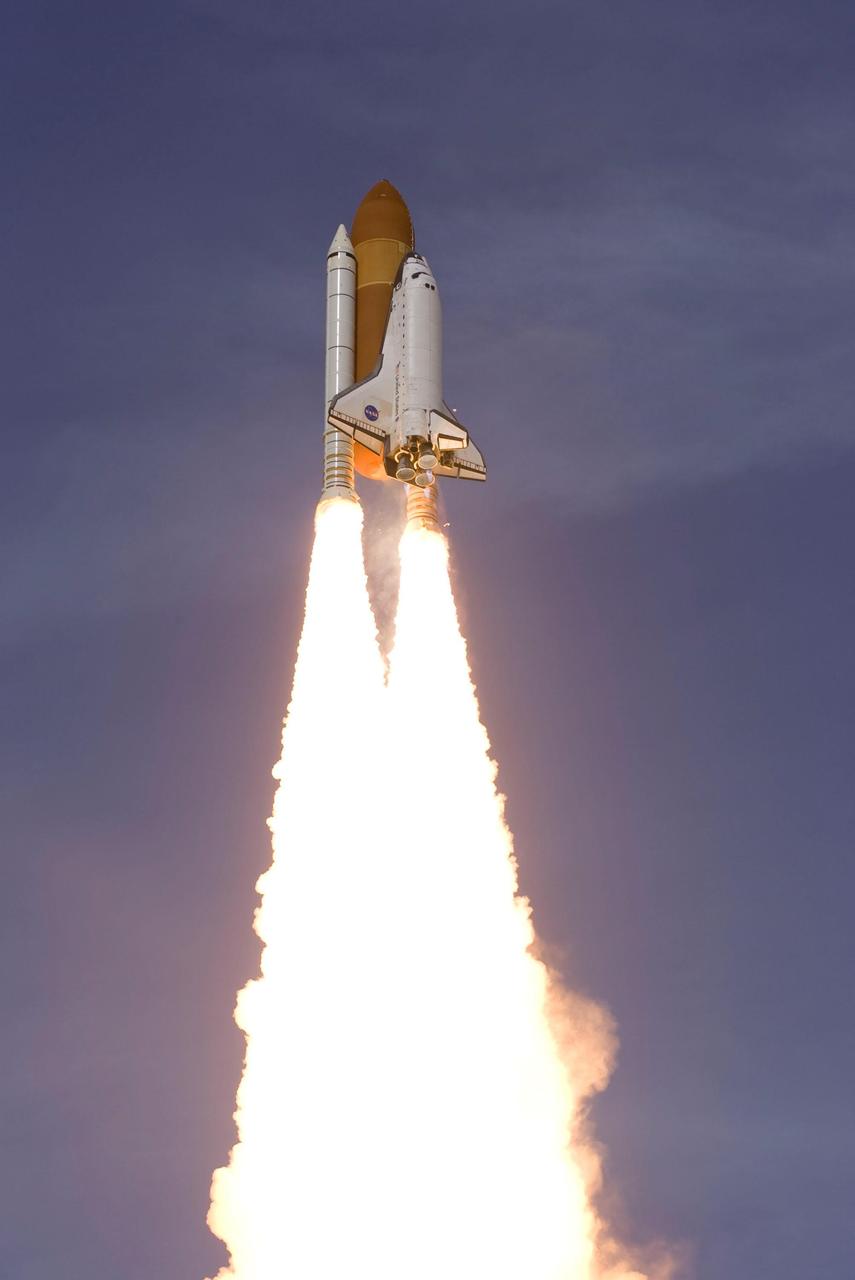 KENNEDY SPACE CENTER, FLA. -- Boosted by the columns of flame from the solid rocket boosters, space shuttle Atlantis hurtles into space for a rendezvous with the International Space Station on mission STS-122. Liftoff was on time at 2:45 p.m. EST. This is the third launch attempt for Atlantis since December 2007 to carry the European Space Agency's Columbus laboratory to the station. During the 11-day mission, the crew's prime objective is to attach the laboratory to the Harmony module, adding to the station's size and capabilities. Photo credit: Scott Andrews