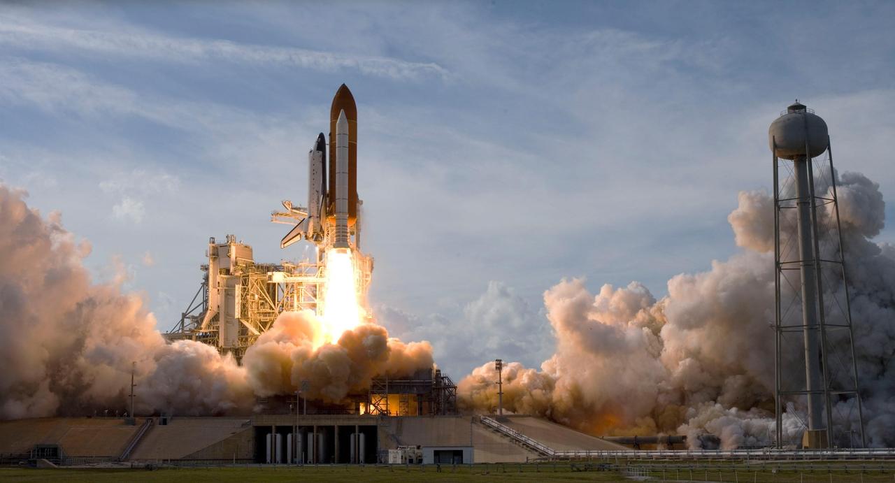 KENNEDY SPACE CENTER, FLA. -- Emerging from the billows of smoke and steam on Launch Pad 39A, space shuttle Atlantis hurtles into space for a rendezvous with the International Space Station on mission STS-122. Liftoff was on time at 2:45 p.m. EST. This is the third launch attempt for Atlantis since December 2007 to carry the European Space Agency's Columbus laboratory to the station. During the 11-day mission, the crew's prime objective is to attach the laboratory to the Harmony module, adding to the station's size and capabilities. Photo credit: Scott Andrews