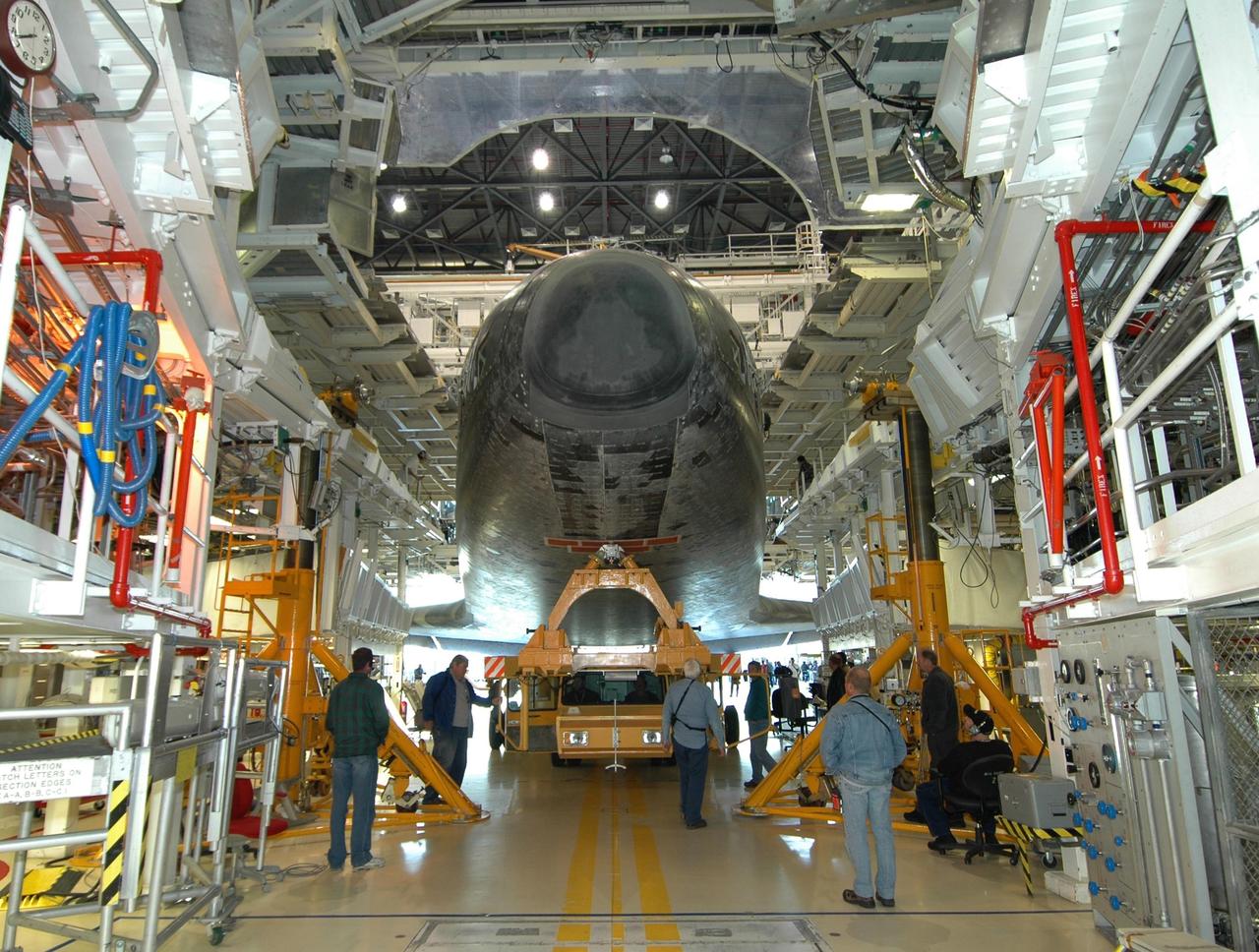 KENNEDY SPACE CENTER, FLA. -- Inside the Orbiter Processing Facility, space shuttle Endeavour settles on its transporter for the trip to the Vehicle Assembly Building. In high bay 1 of the VAB, Endeavour will be attached to its external fuel tank and solid rocket boosters in preparation for its upcoming mission, STS-123, to the International Space Station targeted for March 11. The mission will deliver the first section of the Japan Aerospace Exploration Agency's Kibo laboratory and the Canadian Space Agency's two-armed robotic system, Dextre. Photo credit: NASA/Jim Grossmann