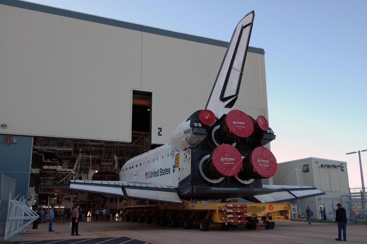 KENNEDY SPACE CENTER, FLA. -- On its transporter, space shuttle Endeavour rolls out of the Orbiter Processing Facility on its way to the Vehicle Assembly Building.  In high bay 1 of the VAB, Endeavour will be attached to its external fuel tank and solid rocket boosters in preparation for its upcoming mission, STS-123, to the International Space Station targeted for March 11.  The mission will deliver the first section of the Japan Aerospace Exploration Agency's Kibo laboratory and the Canadian Space Agency's two-armed robotic system, Dextre.   Photo credit: NASA/Jim Grossmann