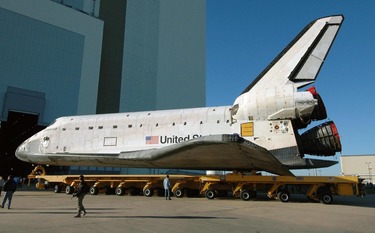 KENNEDY SPACE CENTER, FLA. -- On its transporter, space shuttle Endeavour turns toward the open door of the Vehicle Assembly Building. In high bay 1 of the VAB, Endeavour will be attached to its external fuel tank and solid rocket boosters in preparation for its upcoming mission, STS-123, to the International Space Station targeted for March 11. The mission will deliver the first section of the Japan Aerospace Exploration Agency's Kibo laboratory and the Canadian Space Agency's two-armed robotic system, Dextre. Photo credit: NASA/Jim Grossmann