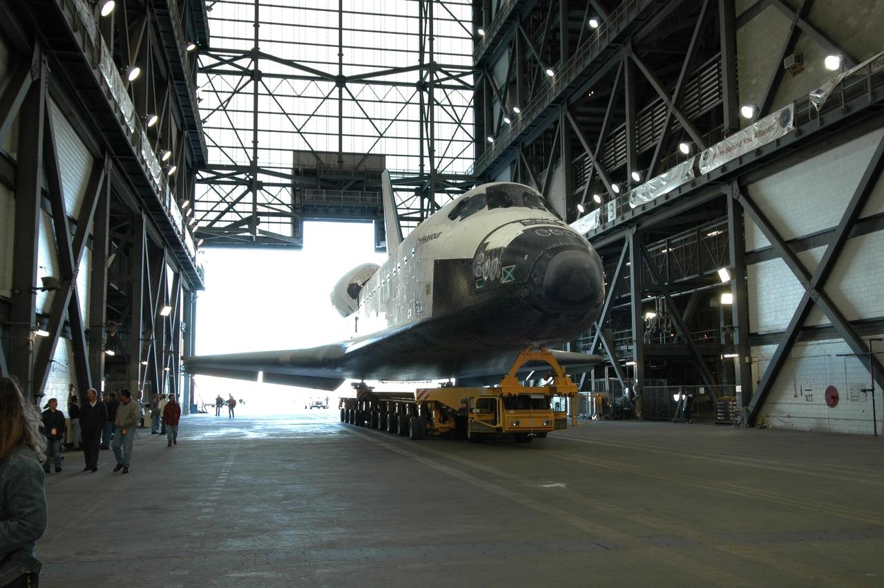 KENNEDY SPACE CENTER, FLA. -- On its transporter, space shuttle Endeavour rolls into the transfer aisle of the Vehicle Assembly Building where it will be lifted into high bay 1. There, Endeavour will be attached to its external fuel tank and solid rocket boosters in preparation for its upcoming mission, STS-123, to the International Space Station targeted for March 11. The mission will deliver the first section of the Japan Aerospace Exploration Agency's Kibo laboratory and the Canadian Space Agency's two-armed robotic system, Dextre. Photo credit: NASA/Jim Grossmann