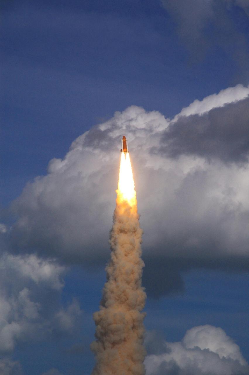 KENNEDY SPACE CENTER, FLA. -- Against a backdrop of clouds, space shuttle Atlantis hurtles into the sky atop a column of fire and smoke on the STS-122 mission. Liftoff was on time at 2:45 p.m. EST. This is the third launch attempt for Atlantis since December 2007 to carry the European Space Agency's Columbus laboratory to the International Space Station. During the 11-day mission, the crew's prime objective is to attach the laboratory to the Harmony module, adding to the station's size and capabilities. Photo credit: NASA/Fletch Hildreth