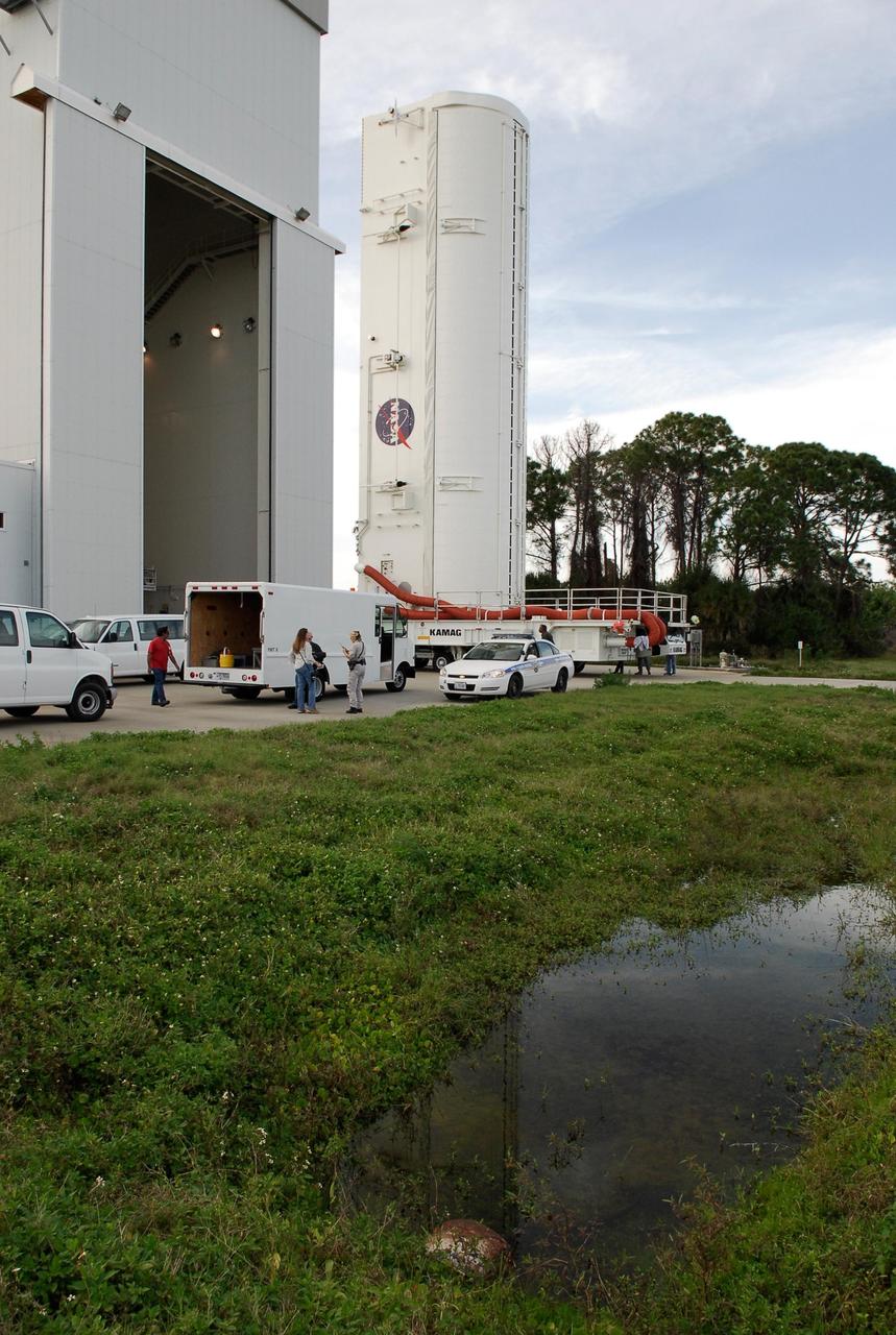 KENNEDY SPACE CENTER, FLA. --  The payload canister moves out of the Vertical Processing Facility, on its way to Launch Pad 39A at NASA's Kennedy Space Center.  The canister is transferring the first section of the Japan Aerospace Exploration Agency's Kibo laboratory and the Canadian Space Agency's two-armed robotic system, Dextre, to the payload changeout room, part of the rotating service structure.  The changeout room is the enclosed, environmentally controlled portion of the rotating service structure that supports cargo delivery to the pad and subsequent vertical installation into an orbiter's payload bay.  The payload will be installed into Endeavour for launch on the STS-123 mission targeted for March 11.  Photo credit: NASA/Kim Shiflett