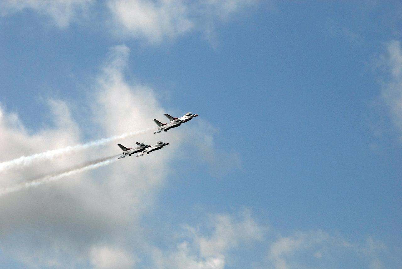KENNEDY SPACE CENTER, FLA. -- The U.S. Air Force Thunderbirds fly over NASA's Kennedy Space Center in commemoration of NASA's 50th anniversary.  The aircraft had flown earlier to support the Daytona 500, also celebrating its 50th anniversary, and chose to fly over Kennedy on their way to their next assignment.   Photo credit: NASA/Jack Pfaller