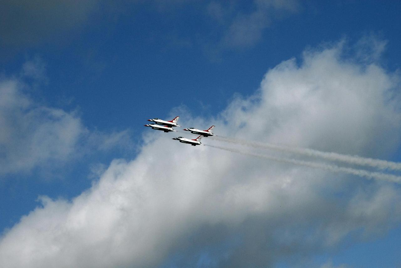 KENNEDY SPACE CENTER, FLA. -- The U.S. Air Force Thunderbirds fly over NASA's Kennedy Space Center in commemoration of NASA's 50th anniversary.  The aircraft had flown earlier to support the Daytona 500, also celebrating its 50th anniversary, and chose to fly over Kennedy on their way to their next assignment.  Photo credit: NASA/Jack Pfaller