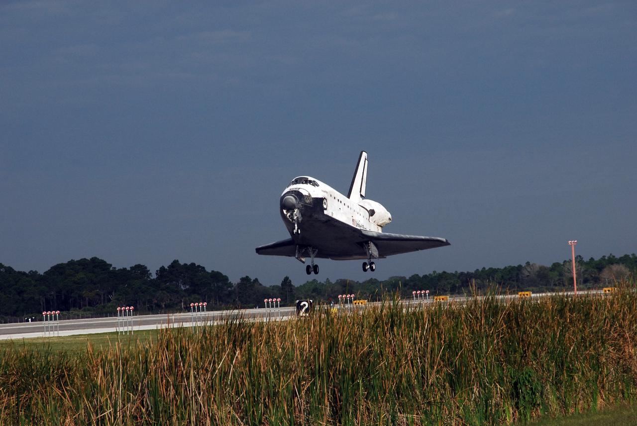KENNEDY SPACE CENTER, FLA. --  The space shuttle Atlantis approaches touch down on Runway 15 of the Shuttle Landing Facility at NASA's Kennedy Space Center. The shuttle landed on orbit 202 to complete the 13-day STS-122 mission. Main gear touchdown was 9:07:10 a.m. Nose gear touchdown was 9:07:20 a.m. Wheel stop was at 9:08:08 a.m. Mission elapsed time was 12 days, 18 hours, 21 minutes and 44 seconds. During the mission, Atlantis' crew installed the new Columbus laboratory, leaving a larger space station and one with increased science capabilities. The Columbus Research Module adds nearly 1,000 cubic feet of habitable volume and affords room for 10 experiment racks, each an independent science lab. Photo credit: NASA/Jack Pfaller