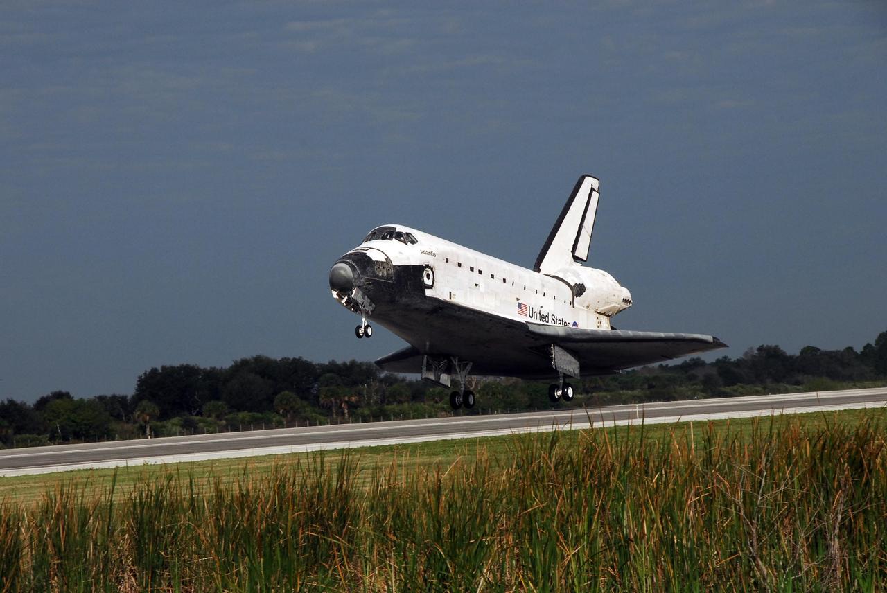 KENNEDY SPACE CENTER, FLA. -- The space shuttle Atlantis approaches touch down on Runway 15 of the Shuttle Landing Facility at NASA's Kennedy Space Center.  The shuttle landed on orbit 202 to complete the 13-day STS-122 mission. Main gear touchdown was 9:07:10 a.m. Nose gear touchdown was 9:07:20 a.m. Wheel stop was at 9:08:08 a.m. Mission elapsed time was 12 days, 18 hours, 21 minutes and 44 seconds. During the mission, Atlantis' crew installed the new Columbus laboratory, leaving a larger space station and one with increased science capabilities. The Columbus Research Module adds nearly 1,000 cubic feet of habitable volume and affords room for 10 experiment racks, each an independent science lab. Photo credit: NASA/Jack Pfaller