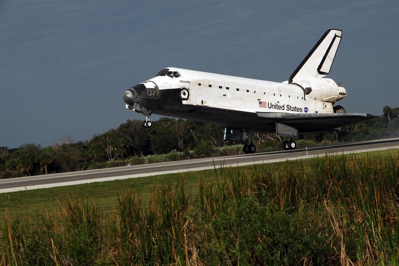 KENNEDY SPACE CENTER, FLA. -- The space shuttle Atlantis touches down on Runway 15 of the Shuttle Landing Facility at NASA's Kennedy Space Center.  The shuttle landed on orbit 202 to complete the 13-day STS-122 mission. Main gear touchdown was 9:07:10 a.m. Nose gear touchdown was 9:07:20 a.m. Wheel stop was at 9:08:08 a.m. Mission elapsed time was 12 days, 18 hours, 21 minutes and 44 seconds. During the mission, Atlantis' crew installed the new Columbus laboratory, leaving a larger space station and one with increased science capabilities. The Columbus Research Module adds nearly 1,000 cubic feet of habitable volume and affords room for 10 experiment racks, each an independent science lab. Photo credit: NASA/Jack Pfaller