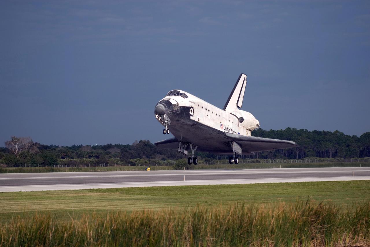 KENNEDY SPACE CENTER, FLA. -- The space shuttle Atlantis approaches touch down on Runway 15 of the Shuttle Landing Facility at NASA's Kennedy Space Center.  The shuttle landed on orbit 202 to complete the 13-day STS-122 mission. Main gear touchdown was 9:07:10 a.m. Nose gear touchdown was 9:07:20 a.m. Wheel stop was at 9:08:08 a.m. Mission elapsed time was 12 days, 18 hours, 21 minutes and 44 seconds. During the mission, Atlantis' crew installed the new Columbus laboratory, leaving a larger space station and one with increased science capabilities. The Columbus Research Module adds nearly 1,000 cubic feet of habitable volume and affords room for 10 experiment racks, each an independent science lab.  Photo credit: NASA/Chris Lynch