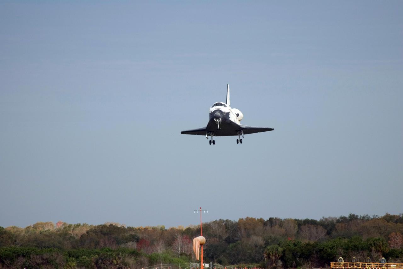 KENNEDY SPACE CENTER, FLA. -- Space shuttle Atlantis has wheels down for a landing as it approaches Runway 15 at NASA's Kennedy Space Center. The shuttle landed on orbit 202 to complete the 13-day STS-122 mission. Main gear touchdown was 9:07:10 a.m. Nose gear touchdown was 9:07:20 a.m. Wheel stop was at 9:08:08 a.m. Mission elapsed time was 12 days, 18 hours, 21 minutes and 44 seconds. During the mission, Atlantis' crew installed the new Columbus laboratory, leaving a larger space station and one with increased science capabilities. The Columbus Research Module adds nearly 1,000 cubic feet of habitable volume and affords room for 10 experiment racks, each an independent science lab. Photo credit: NASA/Tom Farrar