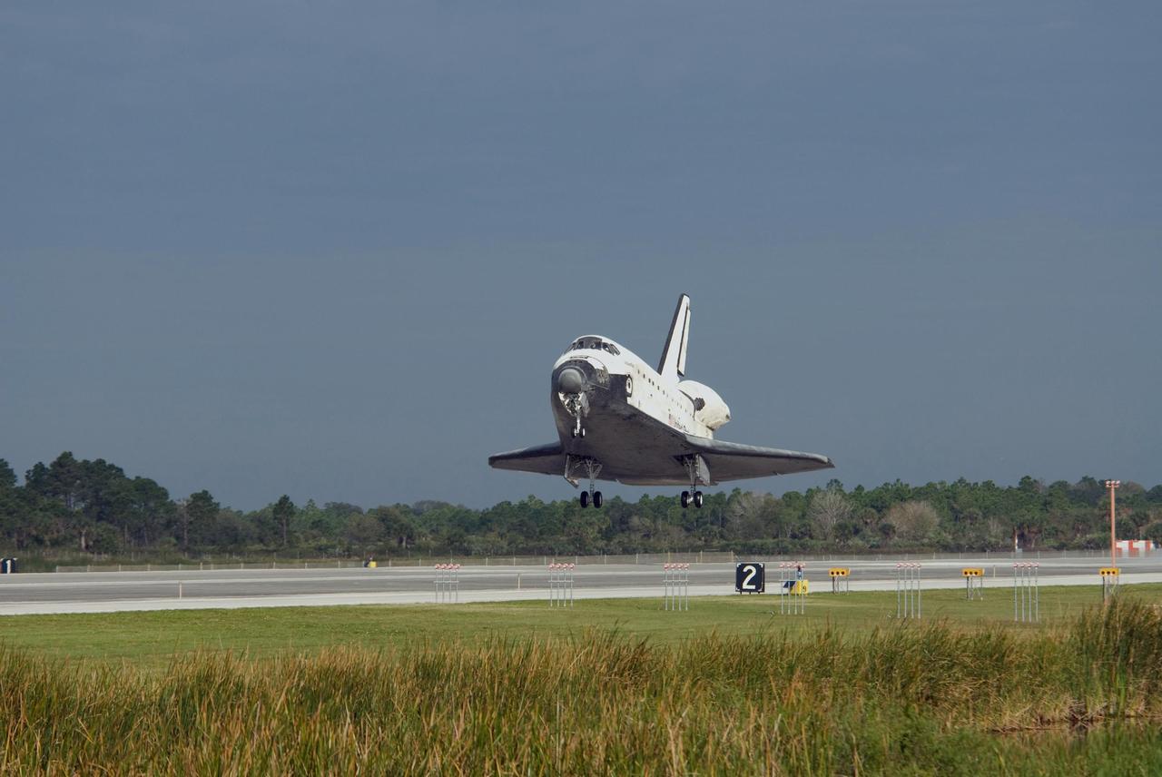 KENNEDY SPACE CENTER, FLA. -- The space shuttle Atlantis approaches touchdown on Runway 15 of the Shuttle Landing Facility at NASA's Kennedy Space Center.  The shuttle landed on orbit 202 to complete the 13-day STS-122 mission. Main gear touchdown was 9:07:10 a.m. Nose gear touchdown was 9:07:20 a.m. Wheel stop was at 9:08:08 a.m. Mission elapsed time was 12 days, 18 hours, 21 minutes and 44 seconds. During the mission, Atlantis' crew installed the new Columbus laboratory, leaving a larger space station and one with increased science capabilities. The Columbus Research Module adds nearly 1,000 cubic feet of habitable volume and affords room for 10 experiment racks, each an independent science lab. Photo credit: NASA/Kevin O'Connell