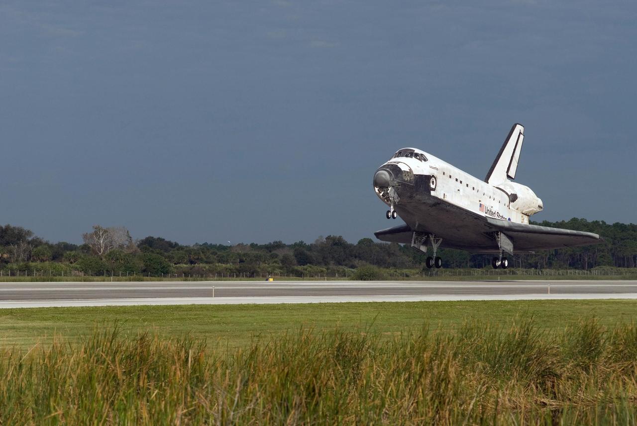 KENNEDY SPACE CENTER, FLA. --  The space shuttle Atlantis nears touchdown on Runway 15 of the Shuttle Landing Facility at NASA's Kennedy Space Center.  The shuttle landed on orbit 202 to complete the 13-day STS-122 mission. Main gear touchdown was 9:07:10 a.m. Nose gear touchdown was 9:07:20 a.m. Wheel stop was at 9:08:08 a.m. Mission elapsed time was 12 days, 18 hours, 21 minutes and 44 seconds. During the mission, Atlantis' crew installed the new Columbus laboratory, leaving a larger space station and one with increased science capabilities. The Columbus Research Module adds nearly 1,000 cubic feet of habitable volume and affords room for 10 experiment racks, each an independent science lab.  Photo credit: NASA/Tom Joseph