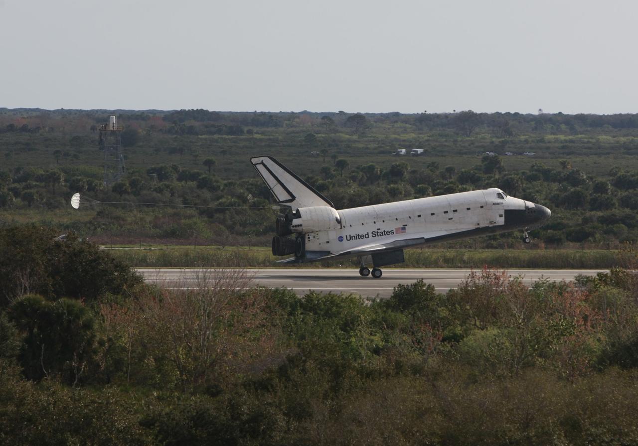 KENNEDY SPACE CENTER, FLA. -- Space shuttle Atlantis touches down on Runway 15 of the Shuttle Landing Facility at NASA's Kennedy Space Center after a nearly 5.3 million mile round trip to the International Space Station. The shuttle landed on orbit 202 to complete the 13-day STS-122 mission. Main gear touchdown was 9:07:10 a.m. Nose gear touchdown was 9:07:20 a.m. Wheel stop was at 9:08:08 a.m. Mission elapsed time was 12 days, 18 hours, 21 minutes and 44 seconds. During the mission, Atlantis' crew installed the new Columbus laboratory, leaving a larger space station and one with increased science capabilities. The Columbus Research Module adds nearly 1,000 cubic feet of habitable volume and affords room for 10 experiment racks, each an independent science lab. Photo courtesy of Scott Andrews