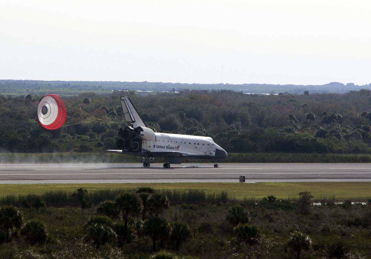 KENNEDY SPACE CENTER, FLA. -- With the aid of a drag chute, space shuttle Atlantis slows down after landing on Runway 15 of the Shuttle Landing Facility at NASA's Kennedy Space Center after a nearly 5.3 million mile round trip to the International Space Station. The shuttle landed on orbit 202 to complete the 13-day STS-122 mission. Main gear touchdown was 9:07:10 a.m. Nose gear touchdown was 9:07:20 a.m. Wheel stop was at 9:08:08 a.m. Mission elapsed time was 12 days, 18 hours, 21 minutes and 44 seconds. During the mission, Atlantis' crew installed the new Columbus laboratory, leaving a larger space station and one with increased science capabilities. The Columbus Research Module adds nearly 1,000 cubic feet of habitable volume and affords room for 10 experiment racks, each an independent science lab. Photo courtesy of Scott Andrews
