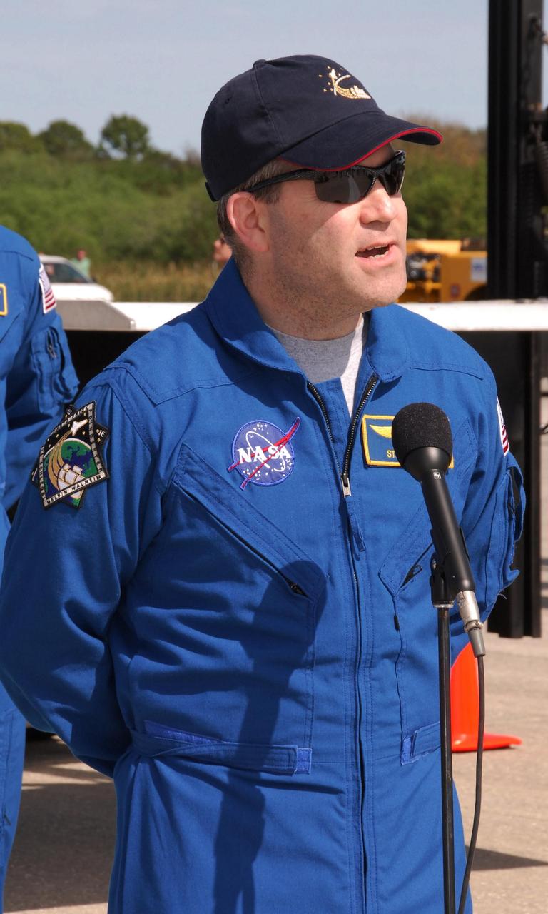 KENNEDY SPACE CENTER, FLA. -- After exiting the crew transport vehicle on the Shuttle Landing Facility at NASA's Kennedy Space Center, STS-122 Commander Steve Frick and Pilot Alan Poindexter begin their examination of the thermal protection system on space shuttle Atlantis. After a round trip of nearly 5.3 million miles, space shuttle Atlantis and crew returned to Earth with a landing at 9:07 a.m. EST. The shuttle landed on orbit 202 to complete the 13-day STS-122 mission. Main gear touchdown was 9:07:10 a.m. Nose gear touchdown was 9:07:20 a.m. Wheel stop was at 9:08:08 a.m. Mission elapsed time was 12 days, 18 hours, 21 minutes and 44 seconds. During the mission, Atlantis' crew installed the new Columbus laboratory, leaving a larger space station and one with increased science capabilities. The Columbus Research Module adds nearly 1,000 cubic feet of habitable volume and affords room for 10 experiment racks, each an independent science lab. Photo credit: NASA/Jack Pfaller