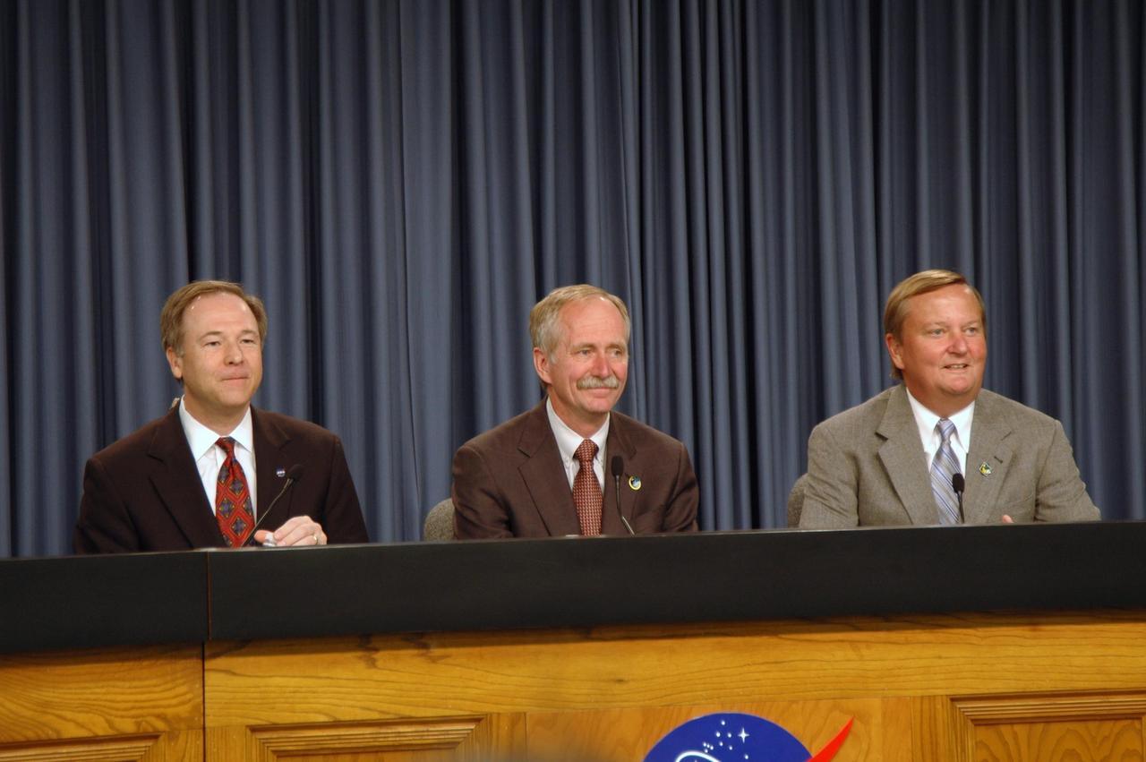 KENNEDY SPACE CENTER, FLA. -- At a post-landing news conference, Assistant Administrator for NASA Public Affairs David Mould (left) introduces NASA Associate Administrator for Space Operations William Gerstenmaier and Shuttle Launch Director Mike Leinbach.  They concurred they were happy with the performance of space shuttle Atlantis on the STS-122 mission and looking forward to the next mission, STS-123 in March. After a round trip of nearly 5.3 million miles, space shuttle Atlantis and crew returned to Earth with a landing at 9:07 a.m. EST. The shuttle landed on orbit 202 to complete the 13-day STS-122 mission. Main gear touchdown was 9:07:10 a.m. Nose gear touchdown was 9:07:20 a.m. Wheel stop was at 9:08:08 a.m. Mission elapsed time was 12 days, 18 hours, 21 minutes and 44 seconds. During the mission, Atlantis' crew installed the new Columbus laboratory, leaving a larger space station and one with increased science capabilities. The Columbus Research Module adds nearly 1,000 cubic feet of habitable volume and affords room for 10 experiment racks, each an independent science lab. Photo credit: NASA/Jim Grossmann