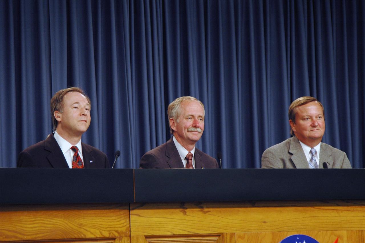 KENNEDY SPACE CENTER, FLA. -- At a post-landing news conference, NASA Associate Administrator for Space Operations William Gerstenmaier and Shuttle Launch Director Mike Leinbach (center and right) answer questions from the media.  At left is Assistant Administrator for NASA Public Affairs David Mould. After a round trip of nearly 5.3 million miles, space shuttle Atlantis and crew returned to Earth with a landing at 9:07 a.m. EST. The shuttle landed on orbit 202 to complete the 13-day STS-122 mission. Main gear touchdown was 9:07:10 a.m. Nose gear touchdown was 9:07:20 a.m. Wheel stop was at 9:08:08 a.m. Mission elapsed time was 12 days, 18 hours, 21 minutes and 44 seconds. During the mission, Atlantis' crew installed the new Columbus laboratory, leaving a larger space station and one with increased science capabilities. The Columbus Research Module adds nearly 1,000 cubic feet of habitable volume and affords room for 10 experiment racks, each an independent science lab. Photo credit: NASA/Jim Grossmann