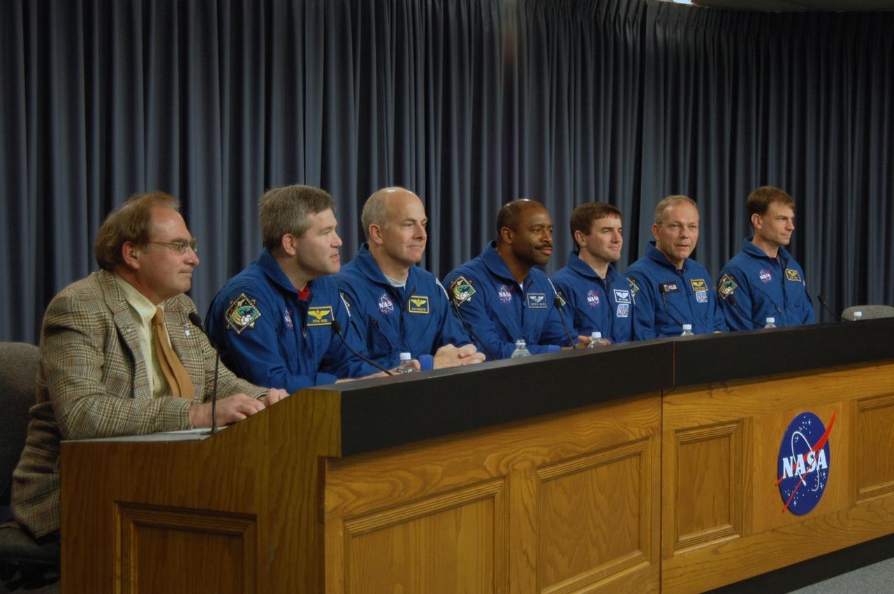 KENNEDY SPACE CENTER, FLA. -- The STS-122 crew discusses its mission at a post-landing conference.  Moderating at left is NASA Public Affairs Officer George Diller.  The crewmembers, from left, are Commander Steve Frick, Pilot Alan Poindexter and Mission Specialists Leland Melvin, Rex Walheim, Hans Schlegel and Stanley Love.  After a round trip of nearly 5.3 million miles, space shuttle Atlantis and crew returned to Earth with a landing at 9:07 a.m. EST on Runway 15 at NASA's Kennedy Space Center.  Photo credit: NASA/Jack Pfaller