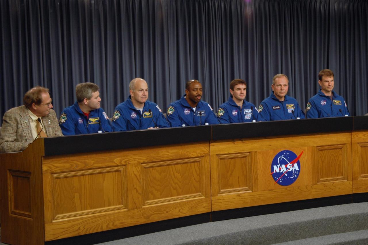 KENNEDY SPACE CENTER, FLA. -- The STS-122 crew discusses its mission at a post-landing conference.  Moderating at left is NASA Public Affairs Officer George Diller.  The crewmembers, from left, are Commander Steve Frick, Pilot Alan Poindexter and Mission Specialists Leland Melvin, Rex Walheim, Hans Schlegel and Stanley Love.  After a round trip of nearly 5.3 million miles, space shuttle Atlantis and crew returned to Earth with a landing at 9:07 a.m. EST on Runway 15 at NASA's Kennedy Space Center.  Photo credit: NASA/Jack Pfaller