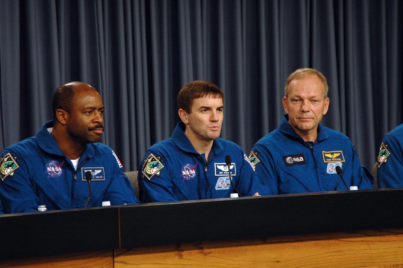 KENNEDY SPACE CENTER, FLA. -- The STS-122 crew discusses its mission at a post-landing conference. Seen here, from left, are Mission Specialists Leland Melvin, Rex Walheim and Hans Schlegel, who represents the European Space Agency. After a round trip of nearly 5.3 million miles, space shuttle Atlantis and crew returned to Earth with a landing at 9:07 a.m. EST on Runway 15 at NASA's Kennedy Space Center. Photo credit: NASA/Jack Pfaller