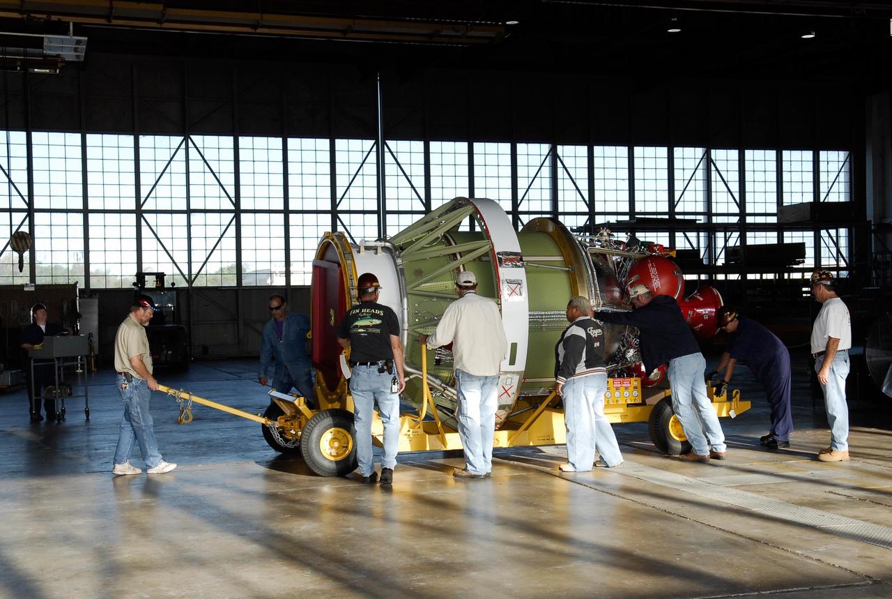 KENNEDY SPACE CENTER, FLA. -- At Cape Canaveral Air Force Station, the Delta II second stage for GLAST has arrived at Hangar M and is moved into place for weighing.  The Delta rocket will be used to launch the Gamma-Ray Large Area Space Telescope, or GLAST, May 16 from Launch Pad 17-B on CCAFS. The GLAST is a powerful space observatory that will explore the Universe's ultimate frontier, where nature harnesses forces and energies far beyond anything possible on Earth;  probe some of science's deepest questions, such as what our Universe is made of, and search for new laws of physics; explain how black holes accelerate jets of material to nearly light speed; and help crack the mystery of stupendously powerful explosions known as gamma-ray bursts.  Photo credit: NASA/Kim Shiflett