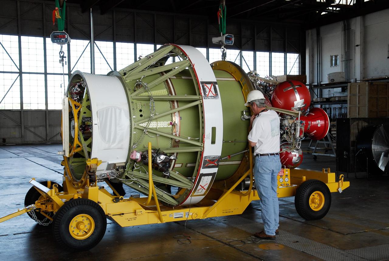 KENNEDY SPACE CENTER, FLA. -- At Cape Canaveral Air Force Station, the Delta II second stage for GLAST has arrived at Hangar M and is prepared for weighing.  The Delta rocket will be used to launch the Gamma-Ray Large Area Space Telescope, or GLAST, May 16 from Launch Pad 17-B on CCAFS. The GLAST is a powerful space observatory that will explore the Universe's ultimate frontier, where nature harnesses forces and energies far beyond anything possible on Earth;  probe some of science's deepest questions, such as what our Universe is made of, and search for new laws of physics; explain how black holes accelerate jets of material to nearly light speed; and help crack the mystery of stupendously powerful explosions known as gamma-ray bursts.  Photo credit: NASA/Kim Shiflett