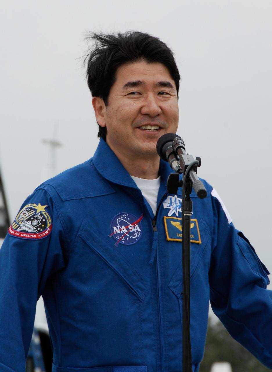 KENNEDY SPACE CENTER, FLA. -- STS-123 Mission Specialist Takao Doi, of the Japan Aerospace Exploration Agency, addresses the news media on hand for his arrival at NASA Kennedy Space Center's Shuttle Landing Facility. The crew for space shuttle Endeavour's STS-123 mission is at Kennedy for a full launch dress rehearsal, known as the terminal countdown demonstration test or TCDT. Endeavour's seven astronauts arrived at Kennedy's Shuttle Landing Facility in their T-38 training aircraft between 10:45 and 10:58 a.m. EST. The terminal countdown demonstration test provides astronauts and ground crews with an opportunity to participate in various simulated countdown activities, including equipment familiarization and emergency training. Endeavour is targeted to launch March 11 at 2:28 a.m. EDT on a 16-day mission to the International Space Station. On the mission, Endeavour and its crew will deliver the first section of the Japan Aerospace Exploration Agency's Kibo laboratory and the Canadian Space Agency's two-armed robotic system, Dextre. Photo credit: NASA/Kim Shiflett