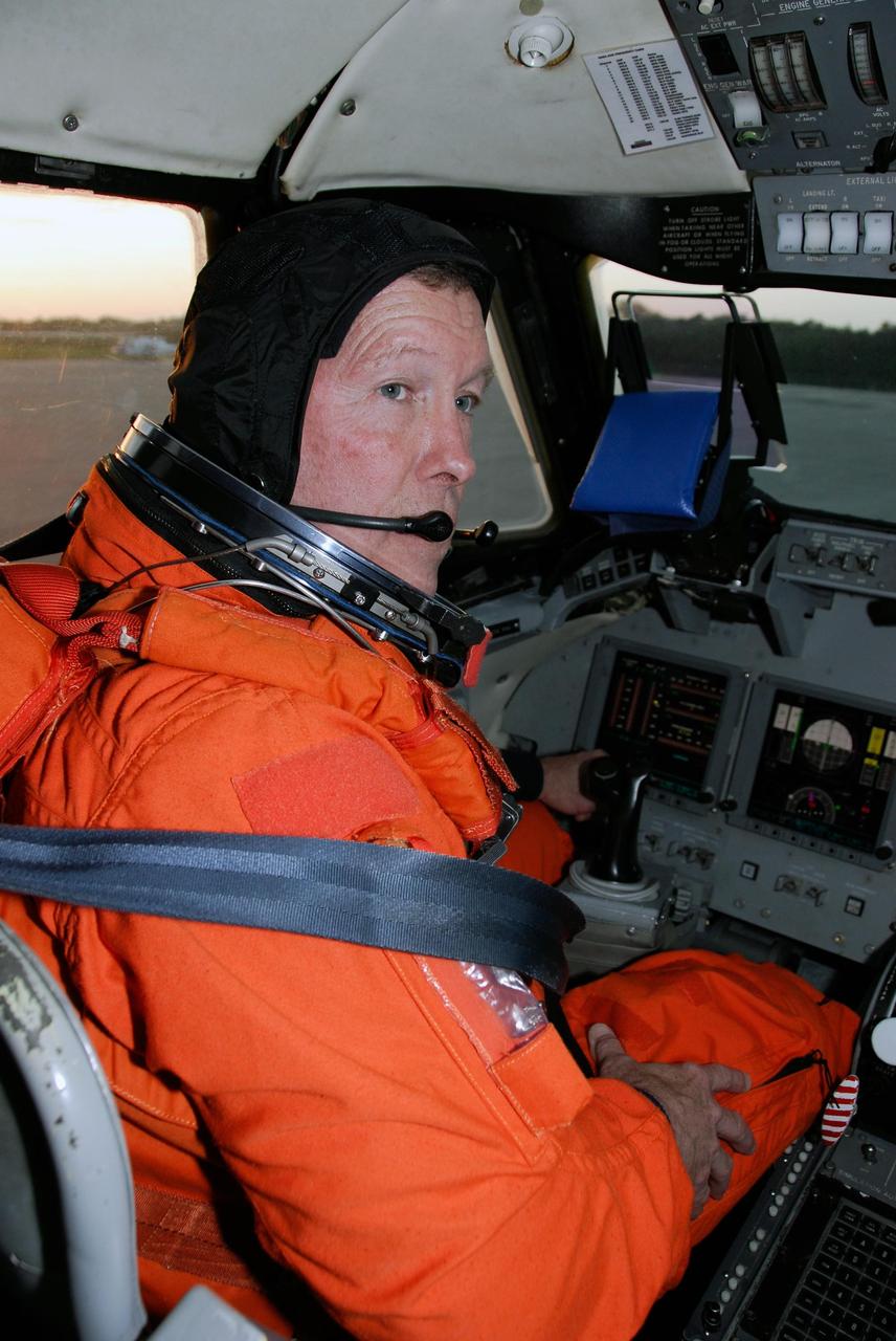 KENNEDY SPACE CENTER, FLA. -- At NASA Kennedy Space Center's Shuttle Landing Facility, STS-123 Commander Dominic Gorie prepares for takeoff in a Shuttle Training Aircraft, or STA, to practice space shuttle landings.    The STA is a Grumman American Aviation-built Gulf Stream II jet that was modified to simulate an orbiter's cockpit, motion and visual cues, and handling qualities. In flight, the STA duplicates the orbiter's atmospheric descent trajectory from approximately 35,000 feet altitude to landing on a runway. Because the orbiter is unpowered during re-entry and landing, its high-speed glide must be perfectly executed the first time.  The crew for space shuttle Endeavour's STS-123 mission is at Kennedy for a full launch dress rehearsal, known as the terminal countdown demonstration test or TCDT.  The terminal countdown demonstration test provides astronauts and ground crews with an opportunity to participate in various simulated countdown activities, including equipment familiarization and emergency training. Endeavour is targeted to launch March 11 at 2:28 a.m. EDT on a 16-day mission to the International Space Station. On the mission, Endeavour and its crew will deliver the first section of the Japan Aerospace Exploration Agency's Kibo laboratory and the Canadian Space Agency's two-armed robotic system, Dextre. Photo credit: NASA/Kim Shiflett