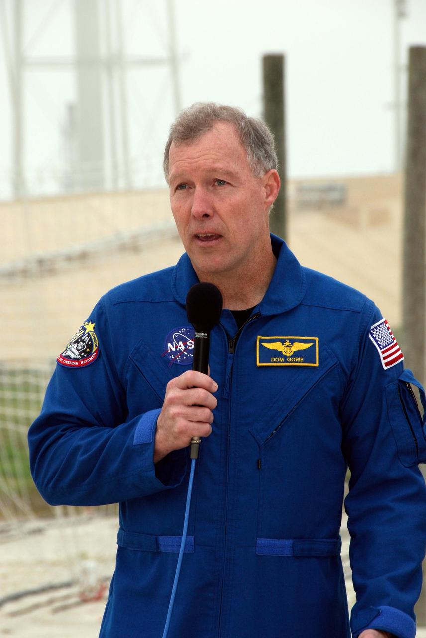 KENNEDY SPACE CENTER, FLA. -- At NASA Kennedy Space Center's Launch Pad 39A, the commander of space shuttle Endeavour's STS-123 mission, Dominic Gorie, answers a question from the media during a break from emergency egress training. The crew is at Kennedy for a full launch dress rehearsal, known as the terminal countdown demonstration test or TCDT. The terminal countdown demonstration test provides astronauts and ground crews with an opportunity to participate in various simulated countdown activities, including equipment familiarization and emergency training. Endeavour is targeted to launch March 11 at 2:28 a.m. EDT on a 16-day mission to the International Space Station. On the mission, Endeavour and its crew will deliver the first section of the Japan Aerospace Exploration Agency's Kibo laboratory and the Canadian Space Agency's two-armed robotic system, Dextre. Photo credit: NASA/Kim Shiflett
