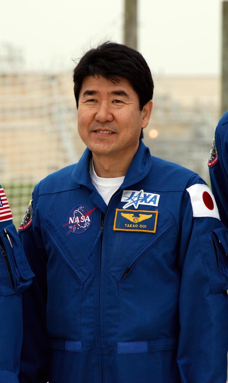 KENNEDY SPACE CENTER, FLA. -- At NASA Kennedy Space Center's Launch Pad 39A, a mission specialist on space shuttle Endeavour's STS-123 mission, Takao Doi of the Japan Aerospace Exploration Agency, prepares to take questions from the media during a break from emergency egress training. The crew is at Kennedy for a full launch dress rehearsal, known as the terminal countdown demonstration test or TCDT. The terminal countdown demonstration test provides astronauts and ground crews with an opportunity to participate in various simulated countdown activities, including equipment familiarization and emergency training. Endeavour is targeted to launch March 11 at 2:28 a.m. EDT on a 16-day mission to the International Space Station. On the mission, Endeavour and its crew will deliver the first section of the Japan Aerospace Exploration Agency's Kibo laboratory and the Canadian Space Agency's two-armed robotic system, Dextre. Photo credit: NASA/Kim Shiflett